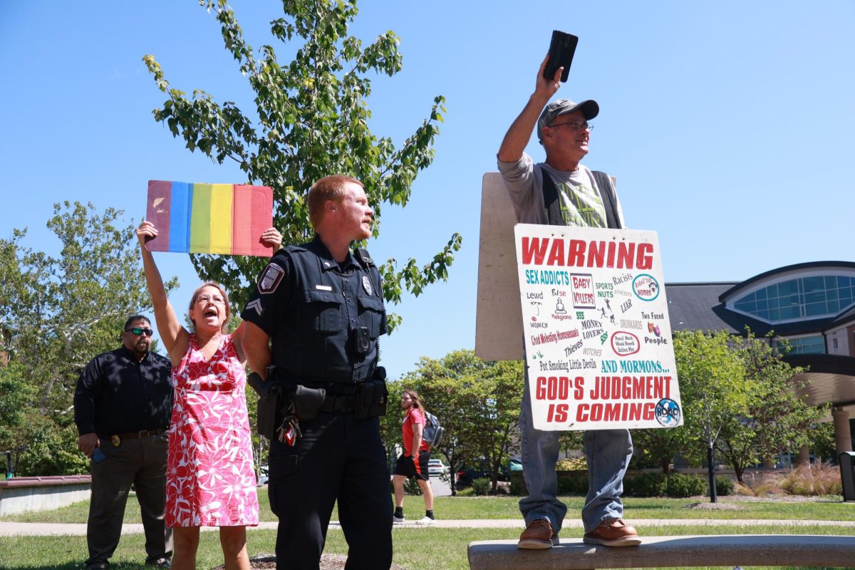 Campus Police talk to Brother Matt during his protest Sept. 14th, 2023 in Carbondale, Illinois. 