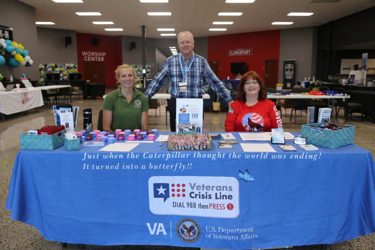 Margot Cepeda (left), Dale Horaz (center) and Kimberly Coloni (right) greet attendees at the entrance of the Veteran Suicide Prevention Summit Sept. 15, 2023 at Cornerstone Church in Marion, Illinois.