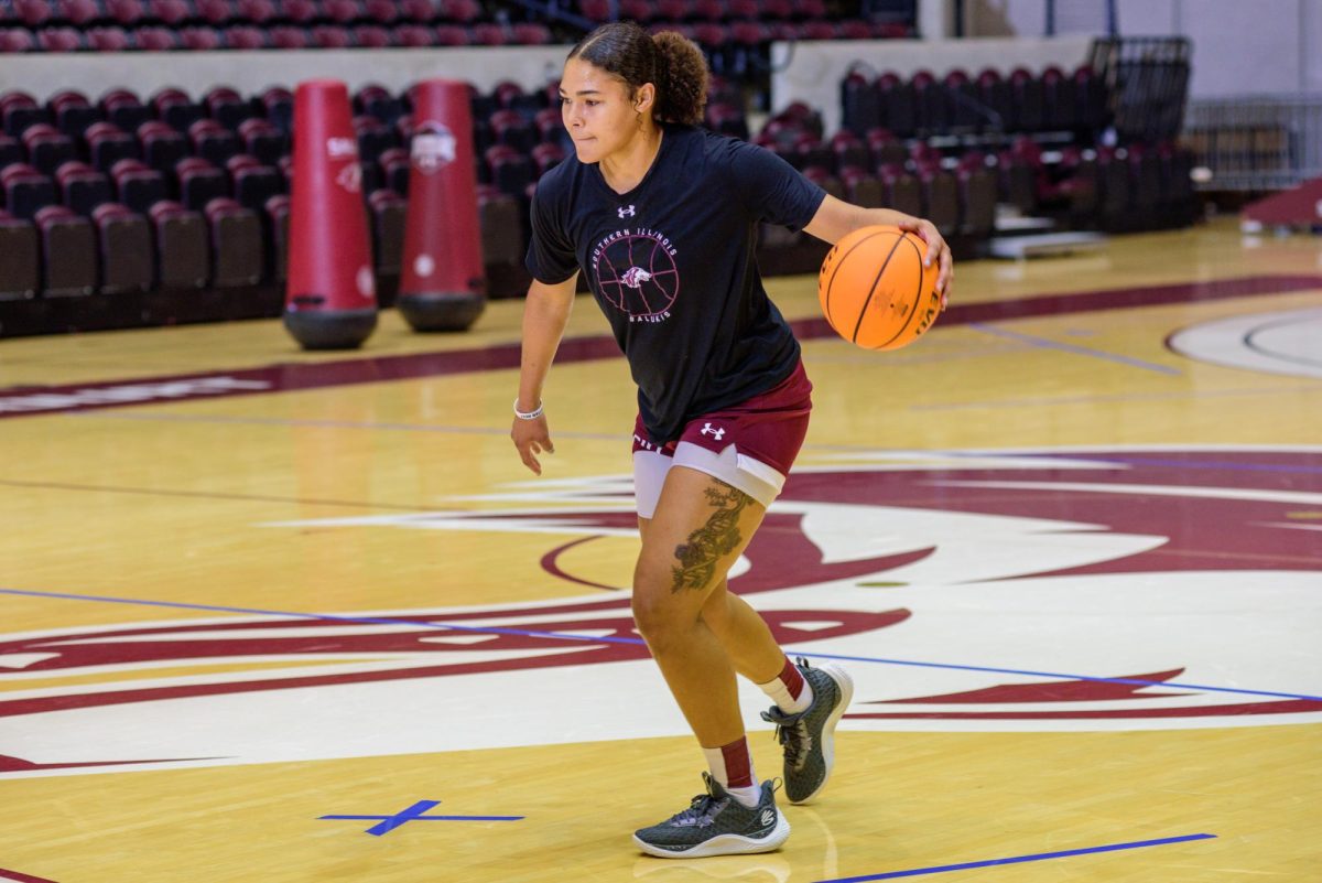 Seairra Hughes (21) drives the ball down the court in an afternoon practice as the Salukis look to begin the upcoming season Oct. 2023 at Banterra Center in Carbondale, Illinois. 
