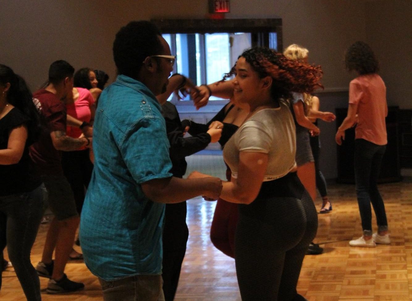 SIU student Janice Vega does a partner dance at the Latin Rhythms Workshop hosted by the Latin American Student Association (LASA) Sept. 22, 2023 at the Student Center Ballrooms in Carbondale, Illinois.