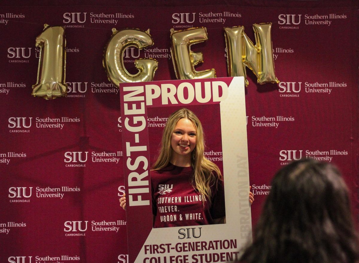 Caroline Romani poses for a photograph for Michelle Soto at the First-Gen College Celebration Kick Off Nov. 8, 2023 at SIU Student Center in Carbondale, Illinois. 