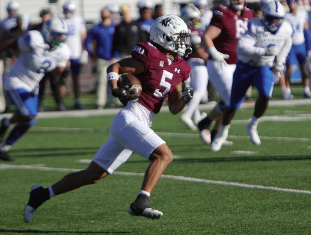 Izaiah Hartrup (5) runs with the ball during a game against Indiana State Nov. 18, 2023 at Saluki Stadium in Carbondale, Illinois. Hartrup scored two touchdowns and tallied 125 receiving yards against Indiana State.
