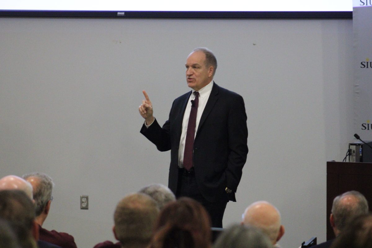 SIU System President Dan Mahony points out reasons for enrollment trends at the SIU system enrollment conference Nov. 3, 2023 at Morris Library in Carbondale, Illinois. 