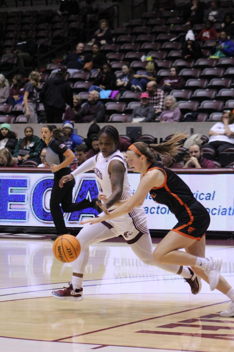 Shemera Williams (11) goes to steal the ball from a Greenville University player at the exhibition game Nov. 1, 2023 at Banterra Center in Carbondale, Illinois.