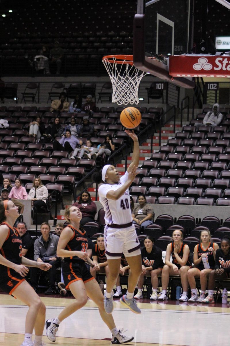 Se’Quoia Allmond jumps to put the ball in the basket in the exhibition against Greenville University Nov. 1, 2023 at Banterra Center in Carbondale, Illinois.