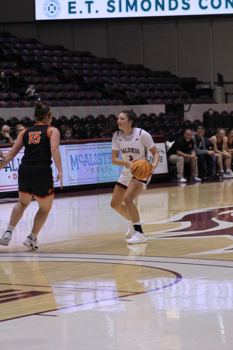 Junior guard Paige Clubb looks to pass to a teammate as SIU faces Greenville in an exhibition game Nov. 1, 2023 at Banterra Center in Carbondale, Illinois.