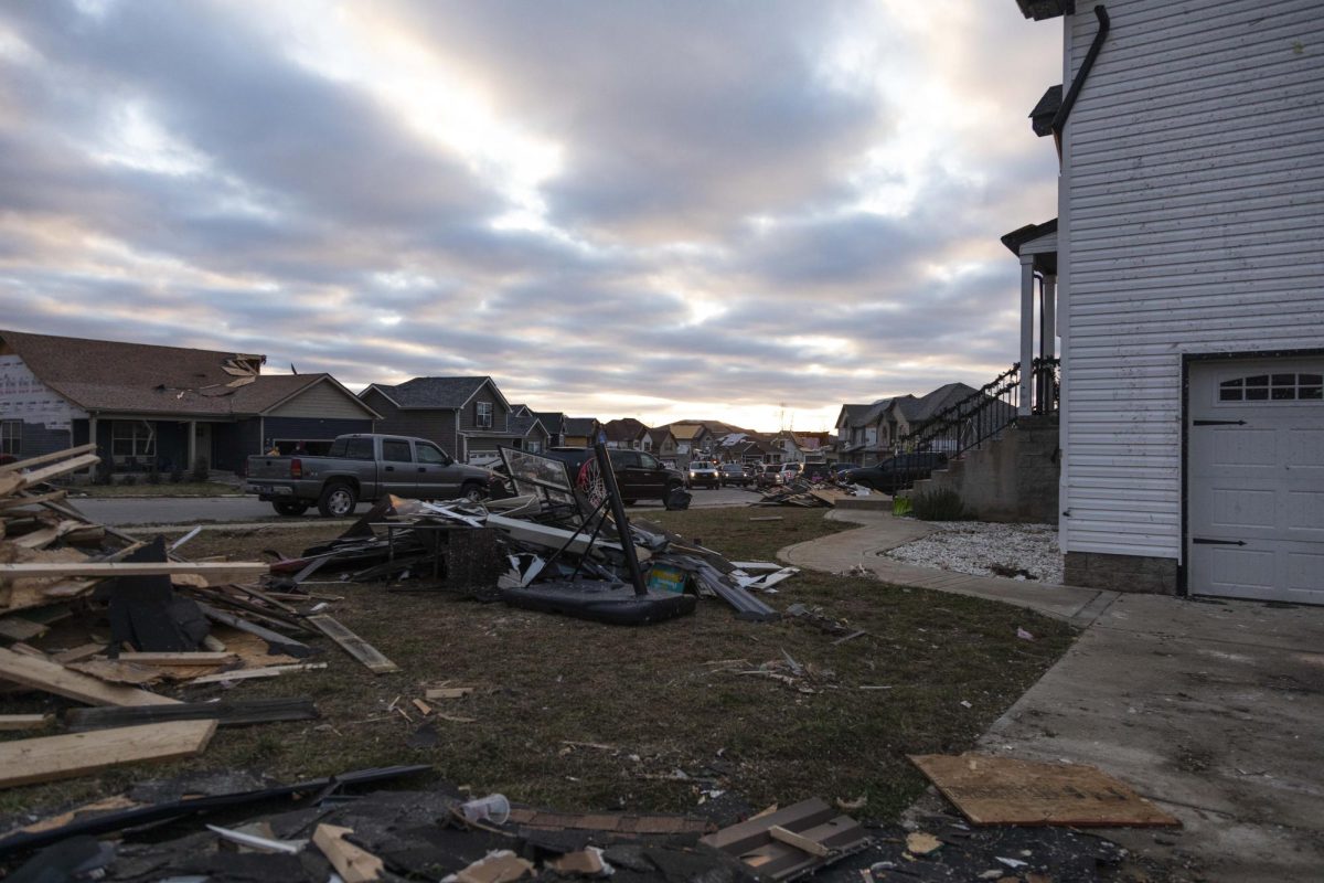 Various piles of debris lay on the lawn of a home on Jackie Lorraine Drive following a storm that devastated the neighborhood Dec. 10, 2023 in Clarksville, Tennessee.