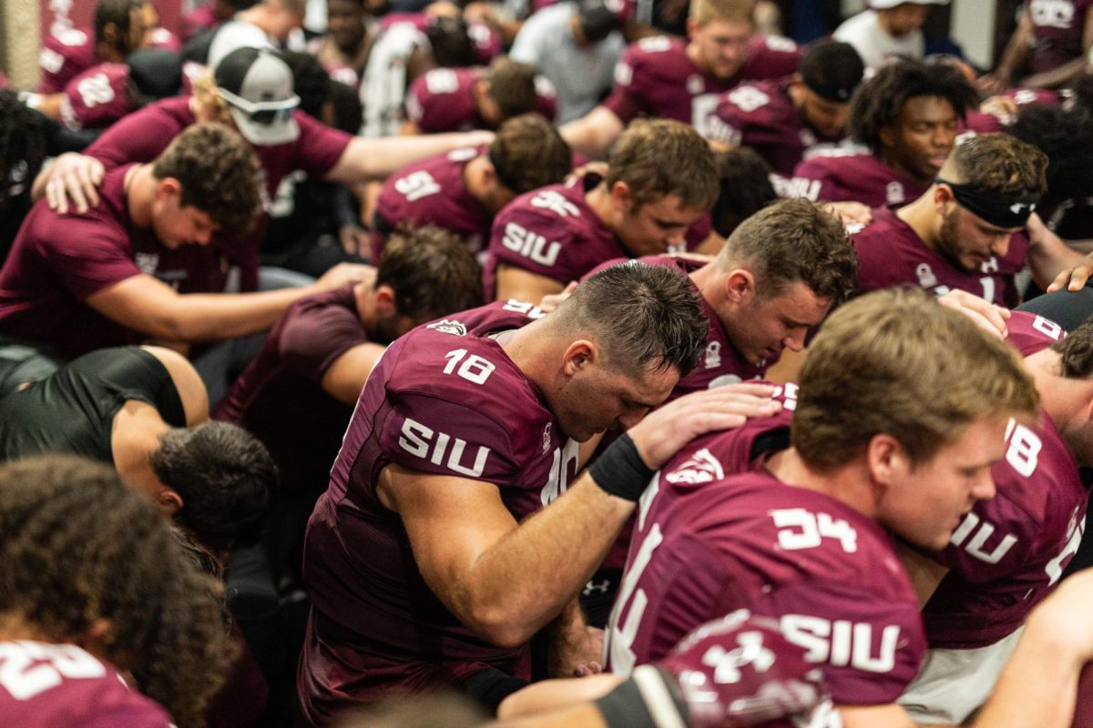 Saluki+football+kneels+together+in+prayer+in+the+locker+room+just+after+hosting+Missouri+State+for+Family+Weekend+Sept.+30%2C+2023+at+Saluki+Stadium+in+Carbondale%2C+Illinois.+