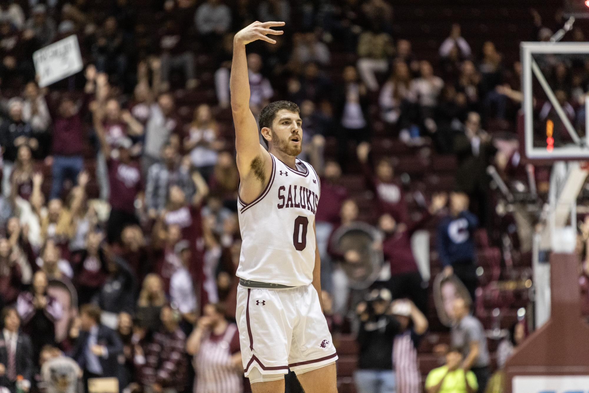 Troy DAmico (0) holds up a three from across the court after scoring for SIU Dec. 2, 2023 at Banterra Center in Carbondale, Illinois. 