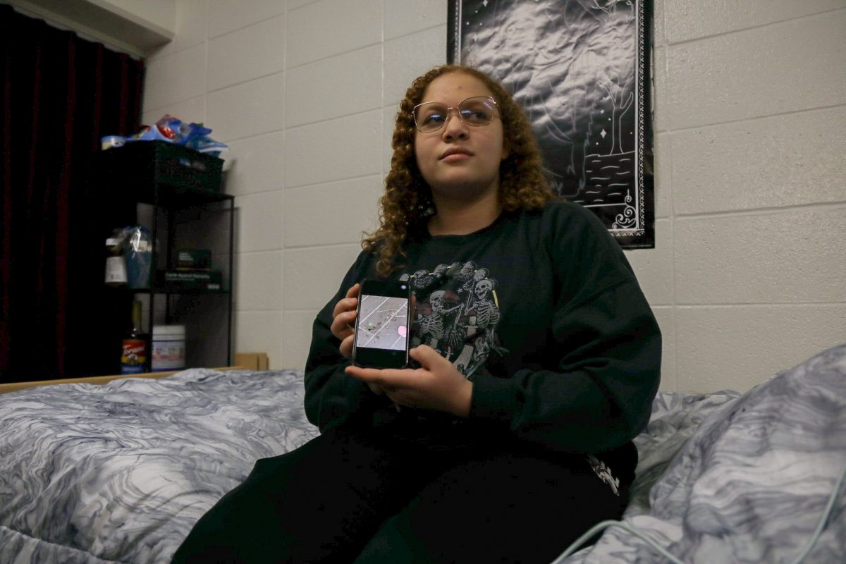 Justyce Petty holds a photo of the bugs that accumulated in her dorm room over winter break Jan. 30, 2024 at Smith Hall on West Campus at SIU in Carbondale, Illinois. “[The roaches] got solved kind of right away but not really because I had been not sleeping in my dorm for four days because I was like ‘what am I supposed to do while theres roaches in my room?’ So I slept in other peoples dorm rooms,” Petty said. Due to the maintenance request being put in right before the weekend, maintenance was not able to immediately fill the requests made by Petty. 