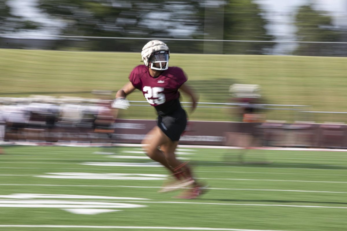 Kayleb Wagner (25) looks back for the throw as he runs through running back drills as the Salukis prepare in an afternoon practice to take on FBS school Northern Illinois later in the week Sept. 6, 2023 at Saluki Stadium in Carbondale, Illinois.