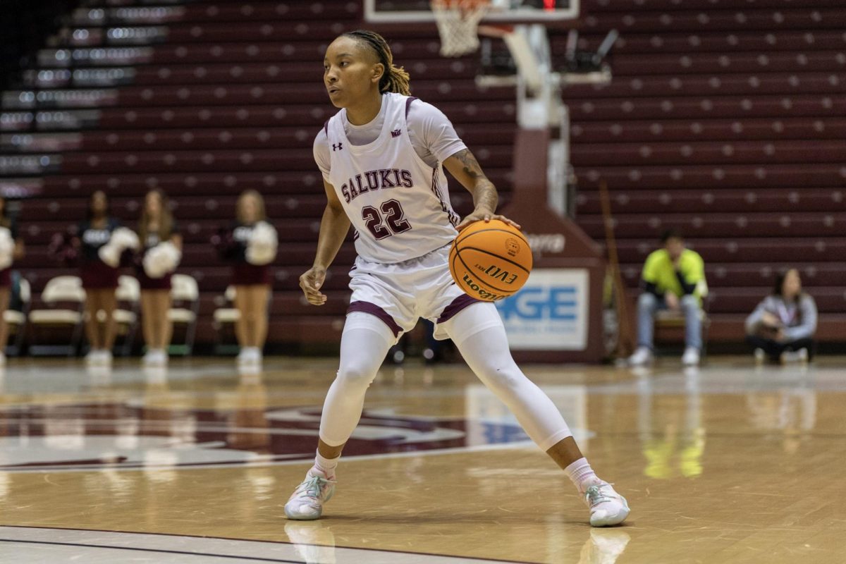 Jaidynn Mason (22) dribbles the ball as the Salukis face Belmont at home Feb. 11, 2024 at Banterra Center in Carbondale, Illinois. @madisongiltnerphoto