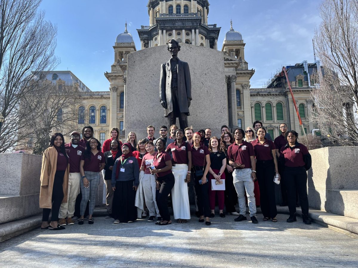 Members of the Black Affairs Council (BAC) stand in front of an Abraham Lincoln statue Feb. 21, 2024 at the
Illinois State Capitol in Springfield, Illinois. 