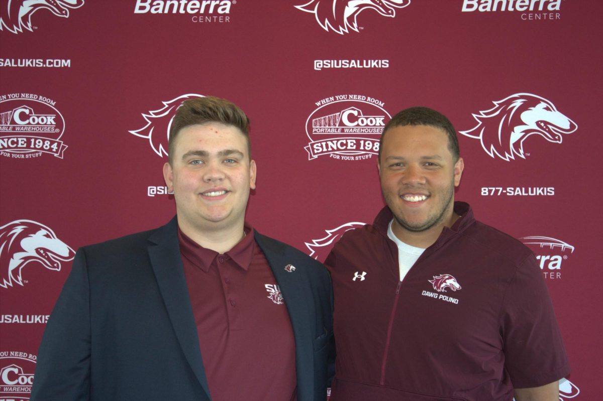 New Dawg Pound President, Corey Crombar, stands next to former Dawg Pound President,
Dylan Chambers April 13, 2024 at Saluki Stadium Suite in Carbondale, Illinois.