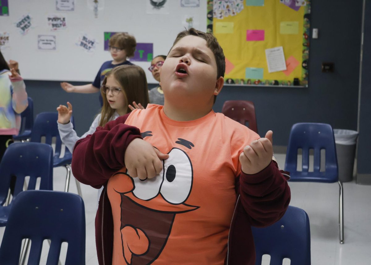 Cobden Elementary Student Brayden Stanley strums his air guitar to the music in Wendy Ronnas music class. A class he missed while battling cancer in the early weeks of April. I really like this class, its fun! Friday, Apr. 12, 2024.