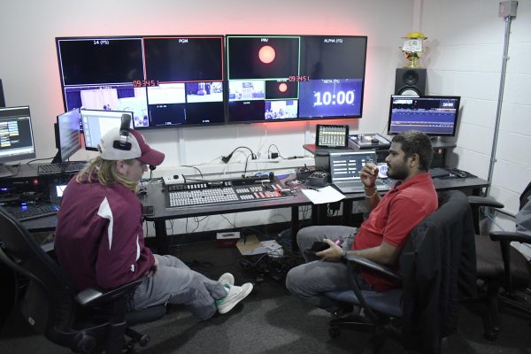 Noah Zarn and Maniteja Parchuri communicate before covering the eclipse from the control room April 8, 2024 at Banterra Center in Carbondale, Illinois.  @iselephotography
