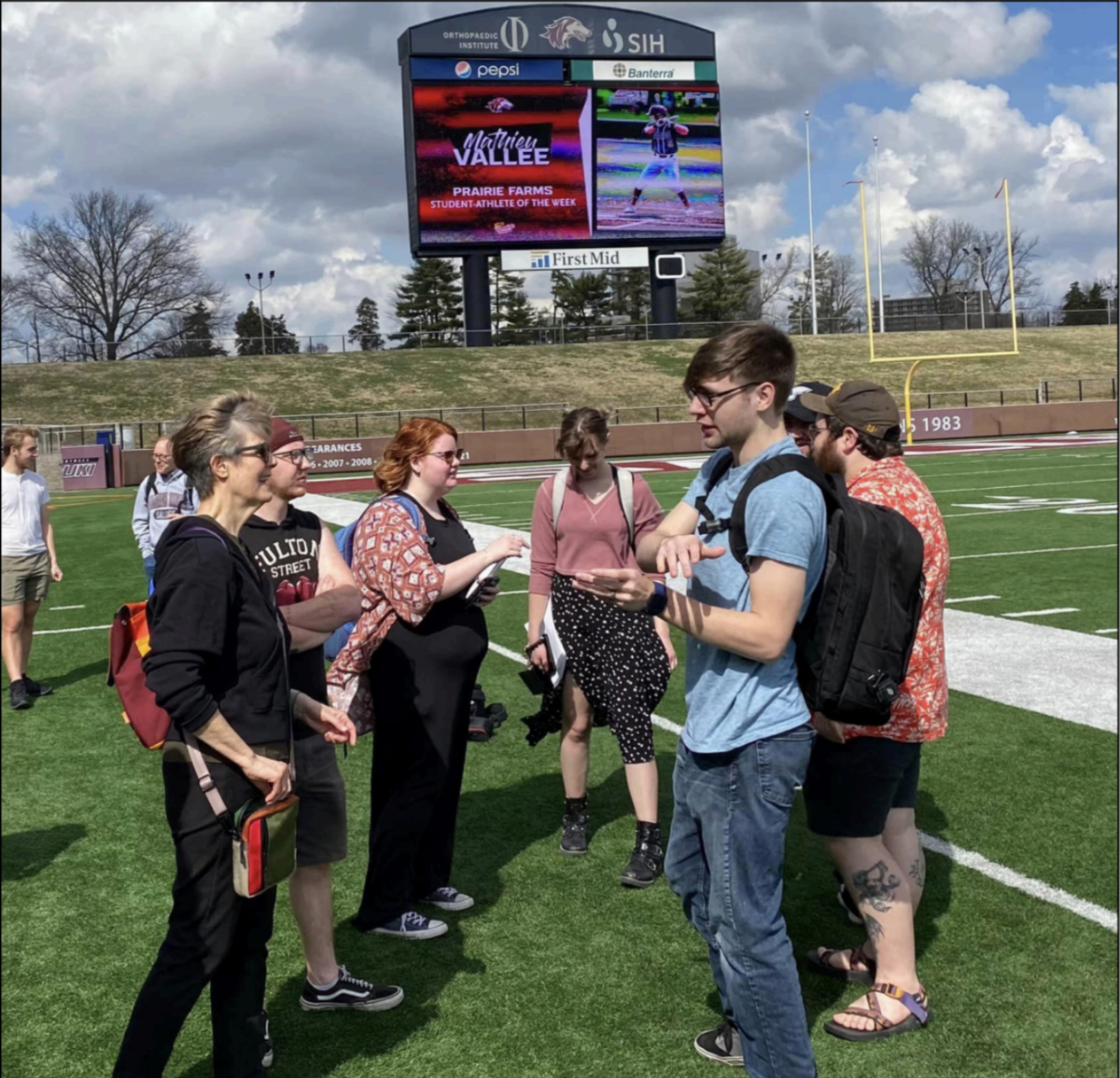 Karla Berry, left in black, discusses plans with her eclipse production students at Saluki Stadium
Photo provided by Mark Stoffel