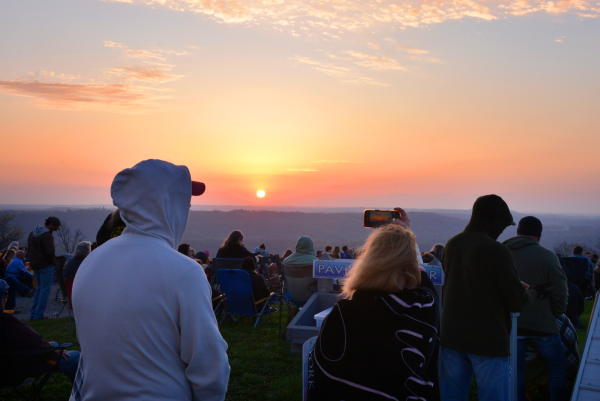 Many admire and photograph the sunrise at Bald Knob Cross March 31, 2024 at Bald Knob Cross of Peace in Alto Pass, Illinois. 