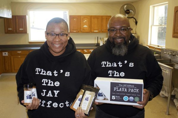 Yemisi and James Anderson holding their Flava Pack Spices from their business The JAY Effect March 20, 2024 at Redeemer Community Church in Carbondale, Illinois. Daylin Williams | dwilliams@dailyegyptian.com