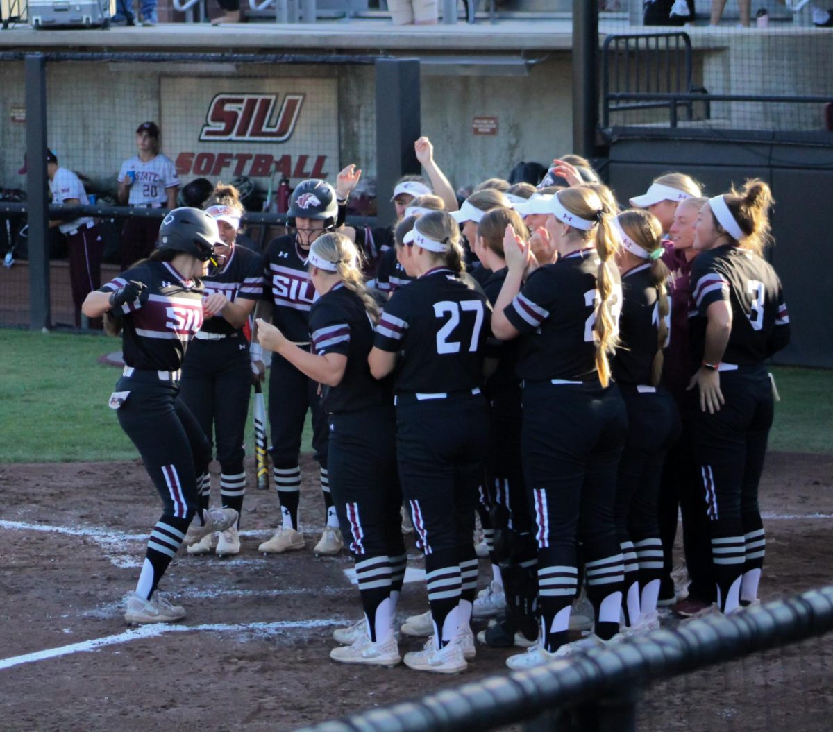 Jackie Lis celebrates with her teammates after hitting a home run against
Missouri State April 24, 2024 at Charlotte West Stadium in Carbondale, Illinois.