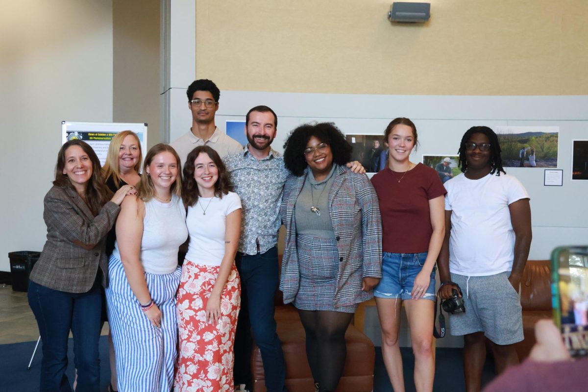 Participants of the “Views of Cobden and Alto Pass” Weekend Workshop take photos after the exhibition and panel
Aug. 24, 2024 at Morris Library in Carbondale, Illinois. Select photos from the weekend will be published in a book
for the public to view. | shardley@dailyegyptian.com