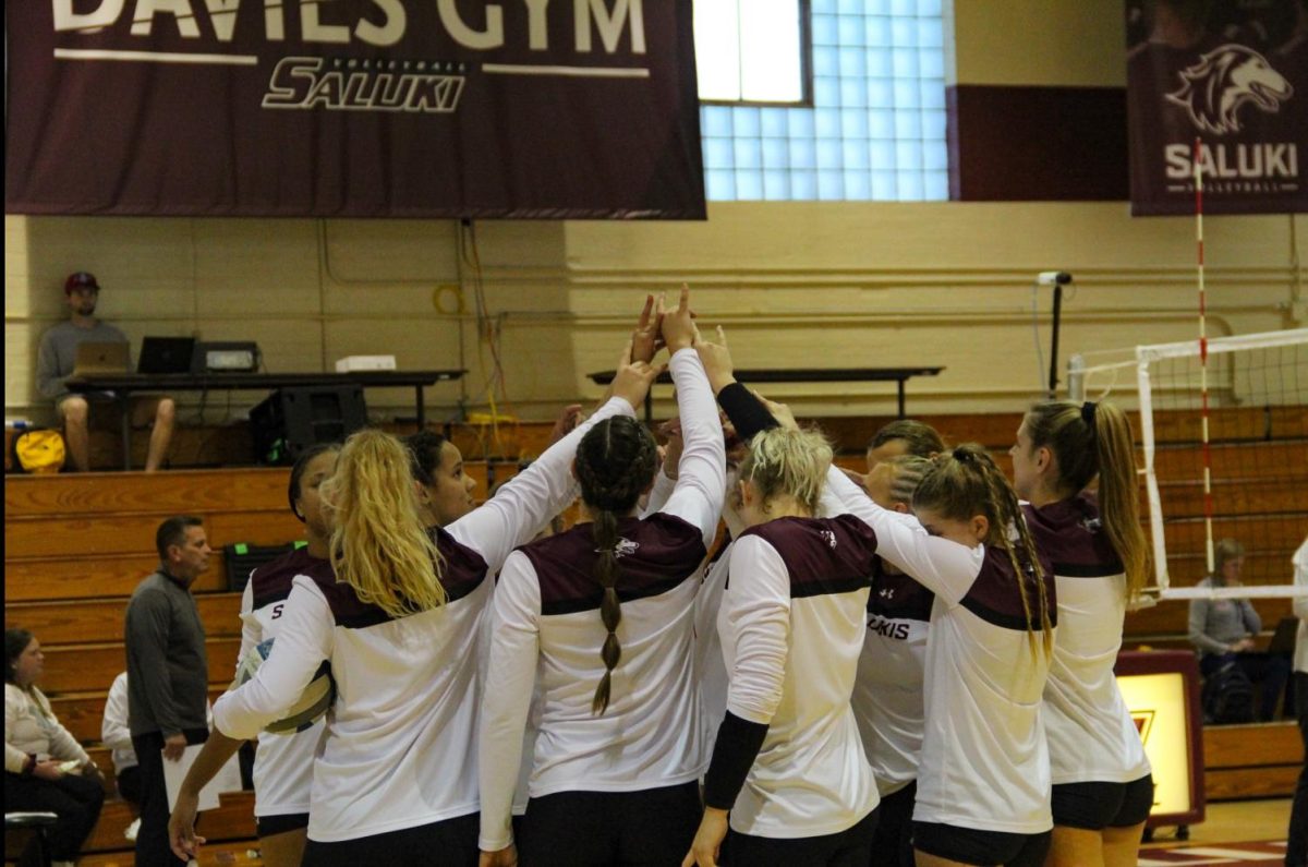 SIU women’s volleyball team does signature group cheer right before the game Oct. 14, 2022 in Davies Gym in Carbondale, Ill. @m0.alexander