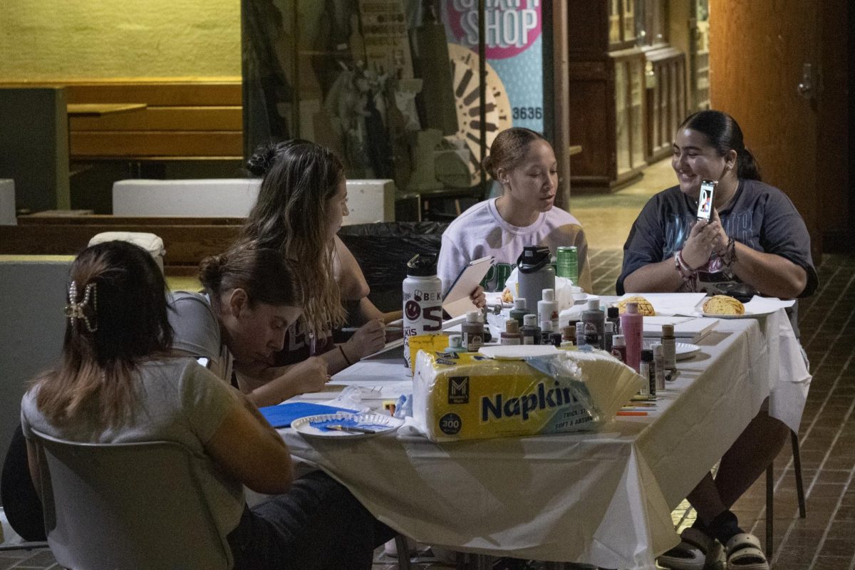 A group of students in the Lambda Theta Alpha Latin sorority at the Paint and Eat a Concha.