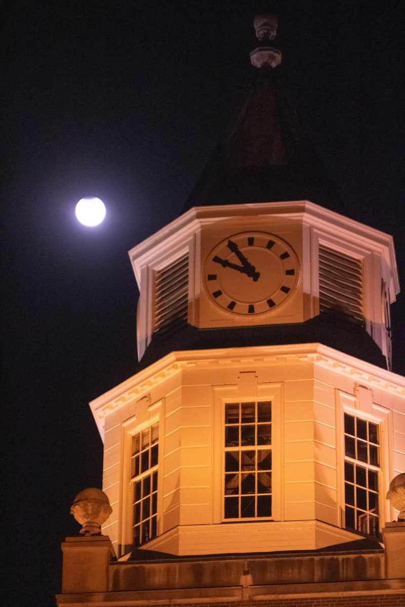 SIU astronomy student Kaleb Yoast (left) and Carbondale native Betsy-Rose Weiss (right) view the moon during the
partial lunar eclipse Sept. 17, 2024 from the observation deck on Necker’s Hall at SIU in Carbondale, Illinois. Weiss
said that she doesn’t normally come to SIU, “But when I hear about something cool, I like to come.”
Enan Chediak | @enanchediak