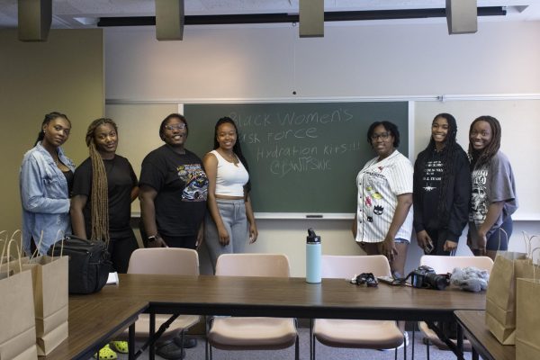 A group of students who volunteered to prepare hydration kits for the Carbondale
Warming Center, Caitlan Laster, Armani Lewis, Jireea Williams, Jilessa Smith, Janiyah
Gaston, Armani Daniels, and Ayanna Burnett (left to right) pose for a group photograph
Aug. 30, 2024 at the Student Center in Carbondale, Illinois.