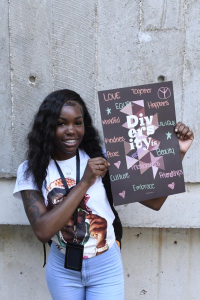 Freshman Tatiana Scales stands for a portrait with her “Diversity Is” poster August 29, 2024 at the SIU Faner Breezeway in Carbondale,Illinois. 