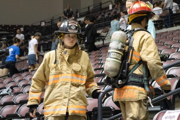 Ellie Kuhn, a member of the Carbondale Township Fire Dept. climbs stairs with Duty Officer John Needham for the 9-11 Saluki Stair Climb Tribute Sept. 11, 2024 at Banterra Center in Carbondale, Illinois.