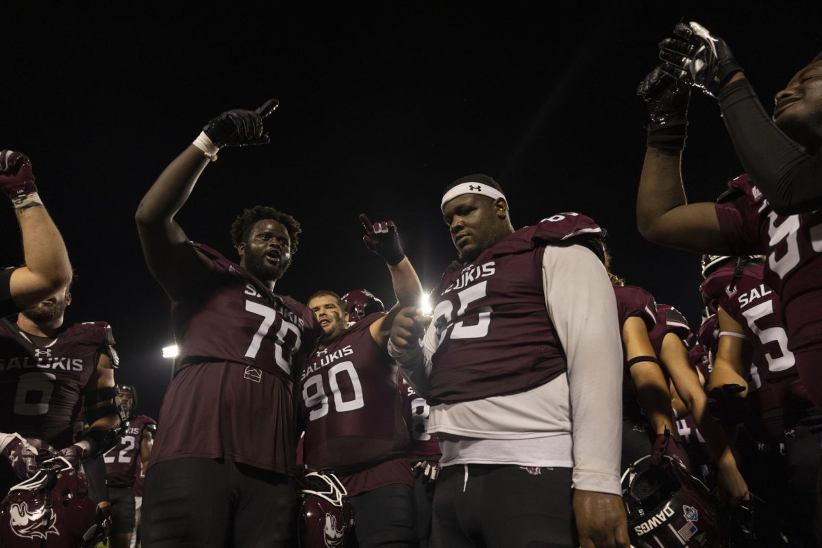 Saluki Football sing the SIU school song towards the stands after the Salukis secured a win over Incarnate Word for the home opener Sept. 14, 2024 at Saluki Stadium in Carbondale, Illinois.