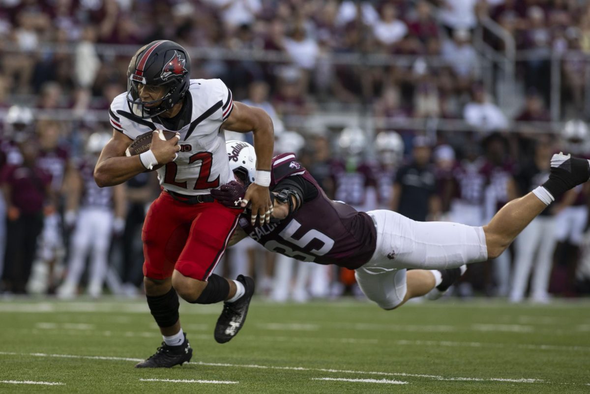 Payton Brown (22) of SEMO runs down the field towards the end zone as he is tackled by Saluki Ben
Bogle (35) Sept. 21, 2024 at Saluki Stadium in Carbondale, Illinois.