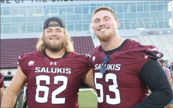 Chase Evans (62) and Noah Fenske (53) stand together during the 13th annual Saluki Fanfest
Aug. 22 at Saluki Stadium in Carbondale, Illinois. Evans and Fenske are key pieces for the
upcoming season’s success. | @Simshardphotography