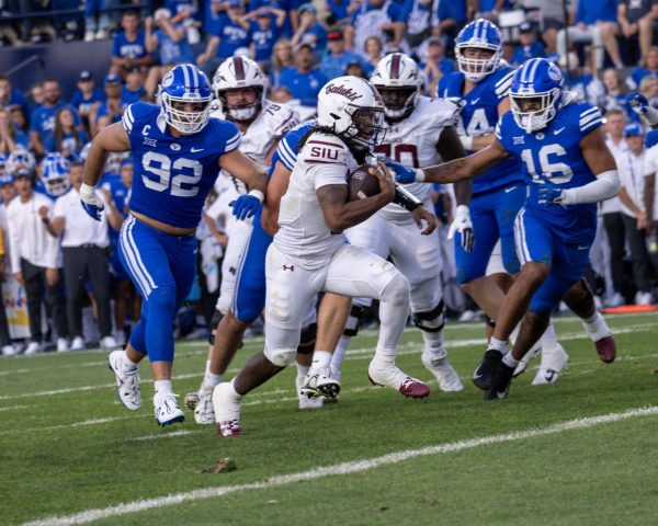 Quarterback DJ Williams (2) runs the ball into the endzone to score against the Cougars of Brigham Young Aug. 31, 2024 at LaVell Edwards Stadium in Provo, Utah. Photo courtesy of Saluki Athletics.  