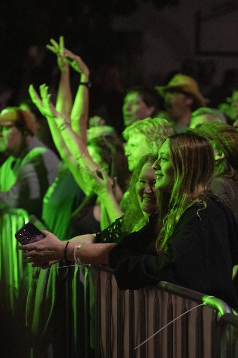 A crowd of people watch the Jungle Dog’s perform Oct. 11, 2024 at The Strip in Carbondale, Illinois.