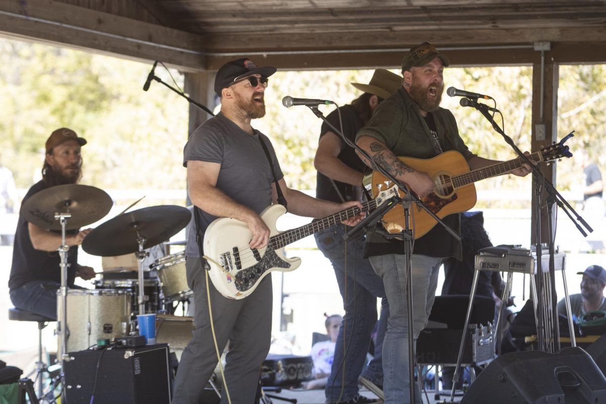 Garrett Burris (left) and Kasey Lee Rogers (right) sing and play during a live
performance at the public park during the Vulture Festival Oct. 19, 2024 in Makanda,
Illinois.