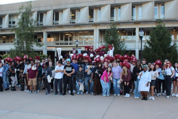 A mass of students and faculty stand together for a group photo during the SIU annual pep rally for ‘Salukis on the Frontier’ homecoming Oct. 7, 2024 at Faner Plaza in Carbondale, Illinois. 
