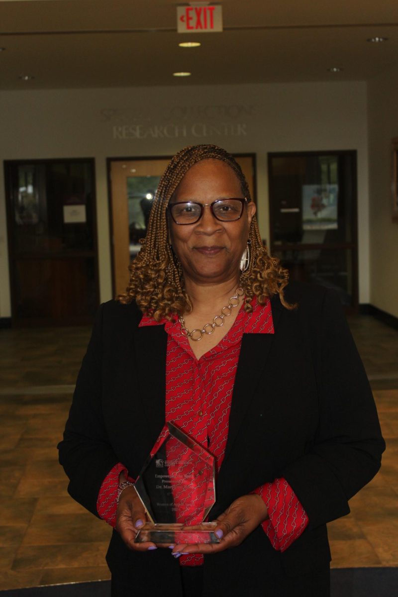 Dr. Marilynn Ross holds her award for empowering the youth Sept. 23, 2024 at John C. Guyon
Auditorium, Carbondale, Illinois. Dr. Ross is the principal at Lewis Elementary School.