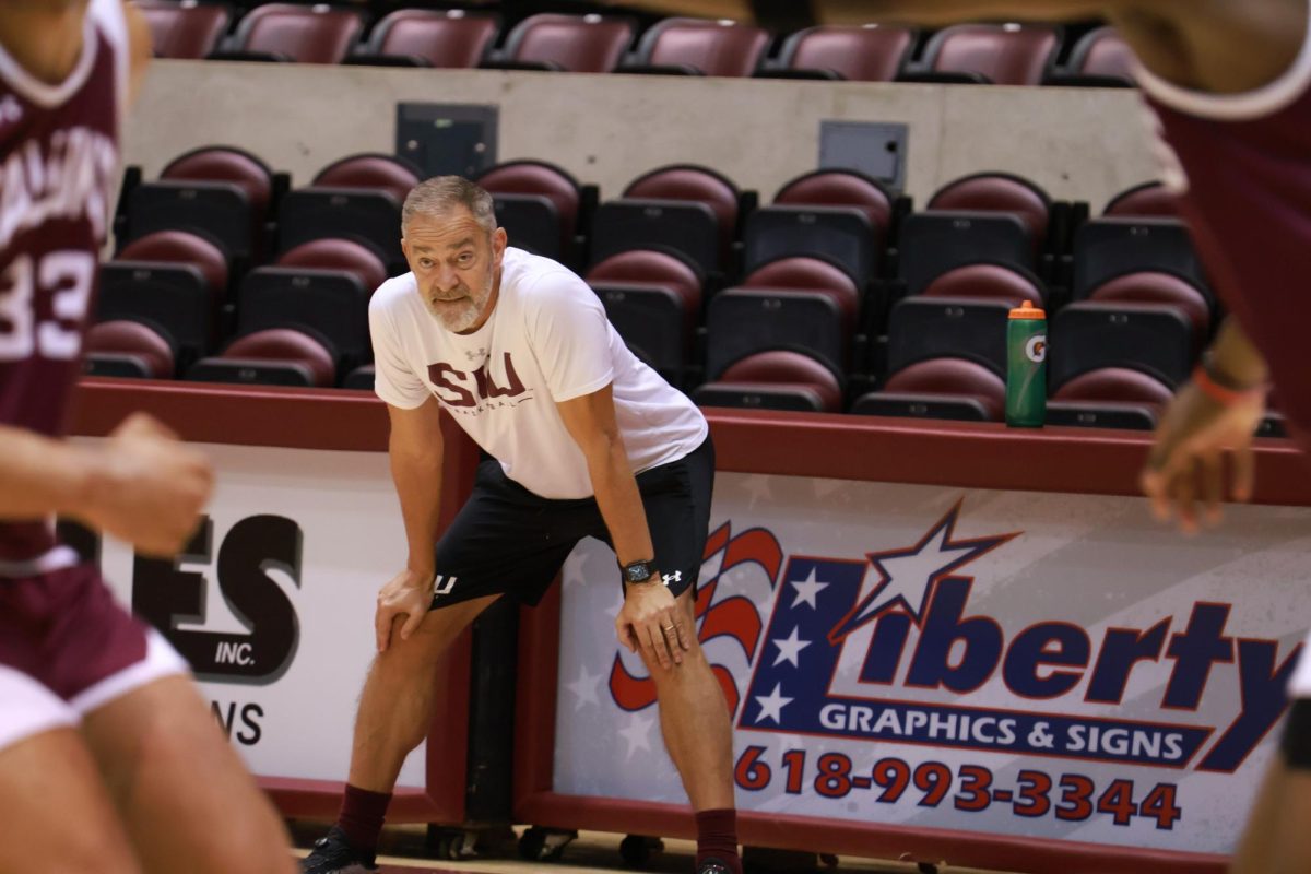 Coach Scott Nagy watches along the baseline during the team scrimmage. Oct. 14, 2024 at
Banterra Center in Carbondale, Illinois. Nagy is the new basketball coach for SIU and brings a
resume of six conference championships under his belt. 
@Simshardphotography