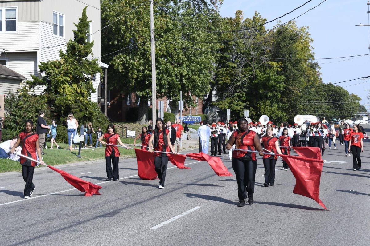 The Marching Cougars of Carbondale Middle School walk in the SIU Homecoming Parade Oct. 12, 2024 in Carbondale, Illinois.