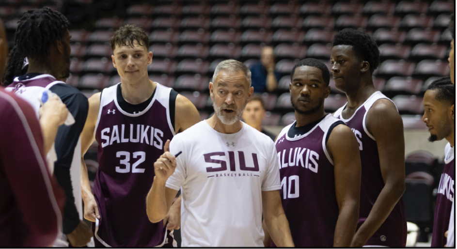 Head coach Scott Nagy speaks to Saluki basketball a huddle during practice Oct.25, 2024 at Banterra Center in Carbondale, Illinois.