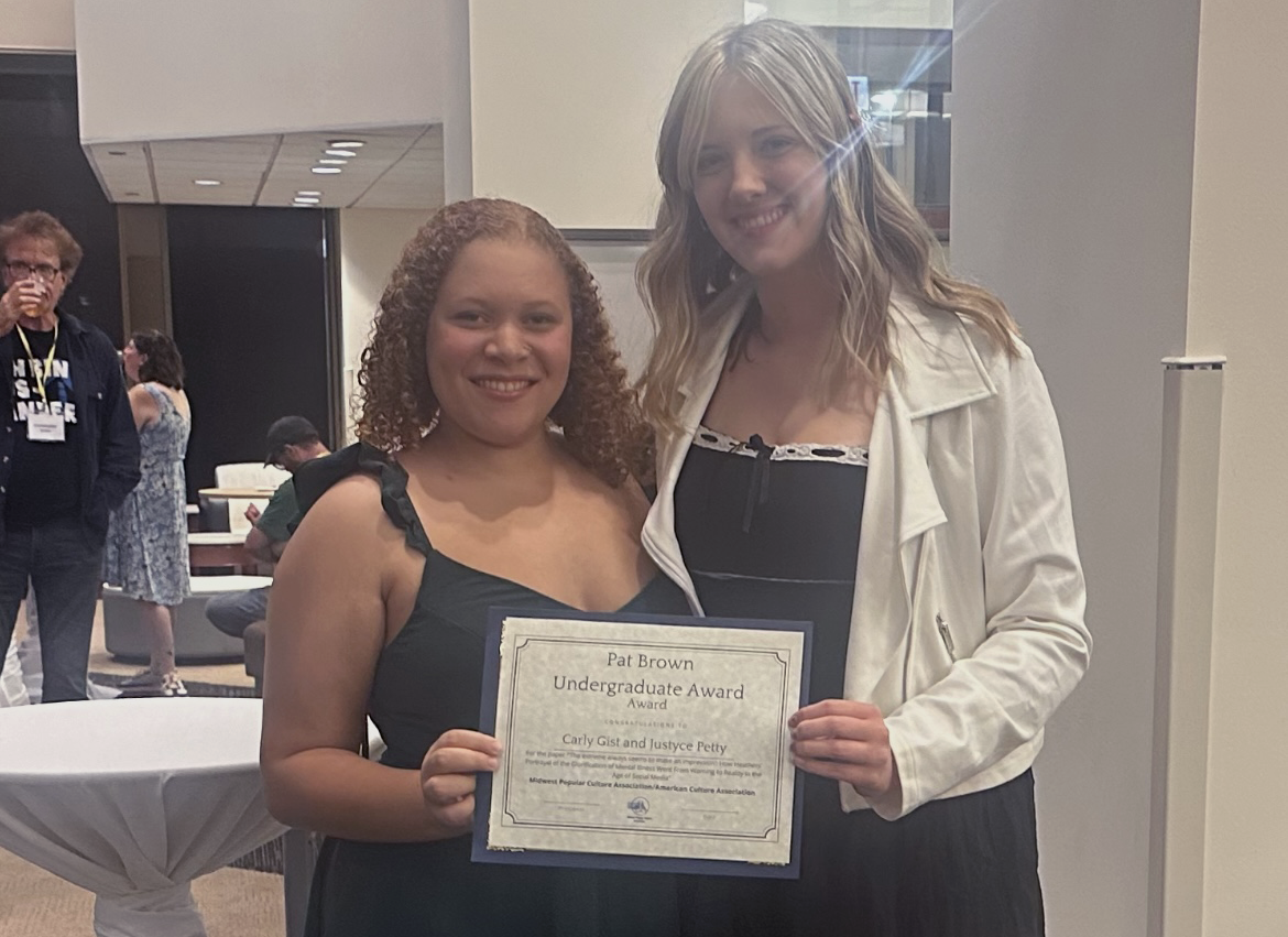 Justyce Petty (left) and Carly Gist (right) hold a certificate for the Pat Brown
Undergraduate Award Oct. 4, 2024 at DePaul University in Chicago, Illinois.
The award recognizes the best paper presented by an undergraduate at the
MPCA/ACA conference each year. Photo Provided.