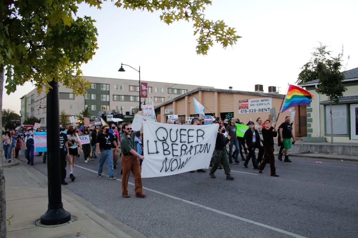 Carbondale protesters march down the strip during the trans-exclusionary event hosted by the SIU chapter of Turning Point USA Oct. 10, 2024 in Carbondale, Illinois.