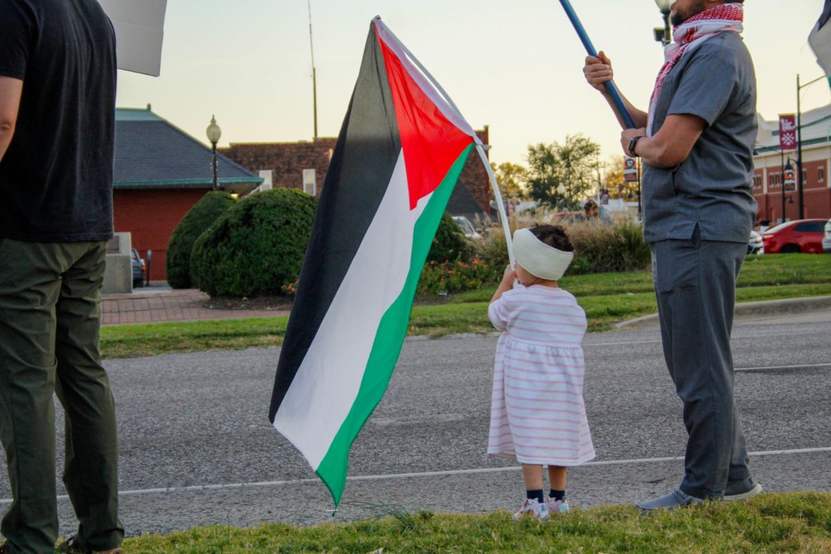 A small child holds a Palestine flag during the No Votes for Genocide rally and march held by
the Southern Illinois chapter of Democratic Socalist of America Oct. 23, 2024 at the Carbondale
Town Square Pavilion in Carbondale, Illinois. Libby Phelps | @libbyphelpsphotography