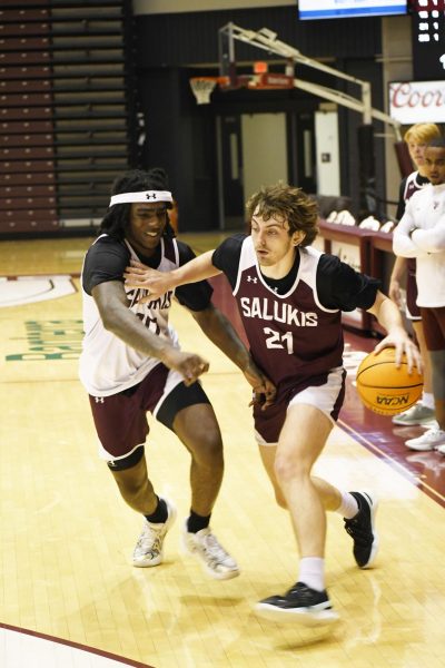 Sophomore Guard Kennard Davis Jr. (30) attempts to guard Redshirt Freshman Guard Drew Steffe (21) during practice at the Banterra Center in Carbondale, IL Friday, November 1, 2024. Jason Isele | @iselephotography 
