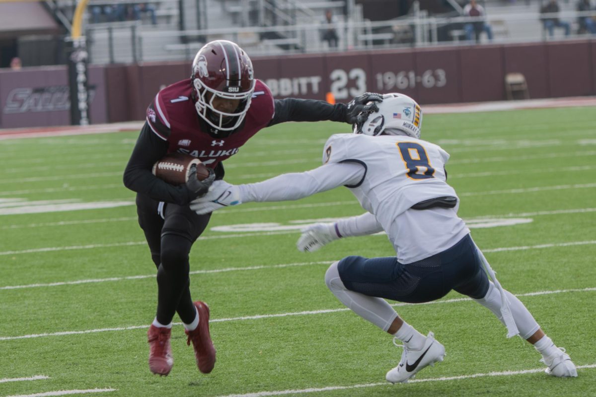 Keontez Lewis (1) rushes towards the end zone as Amari Wansley (8) of Murray State tries to block Nov. 23, 2024 at Saluki Stadium in Carbondale Illinois. 