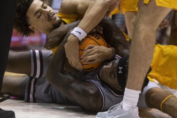 Kennard Davis Jr. (30) fights for the ball on the floor against Jeremiah Burke (2) of North Dakota State Nov. 18, 2024 at Banterra Center in Carbondale, Illinois. 