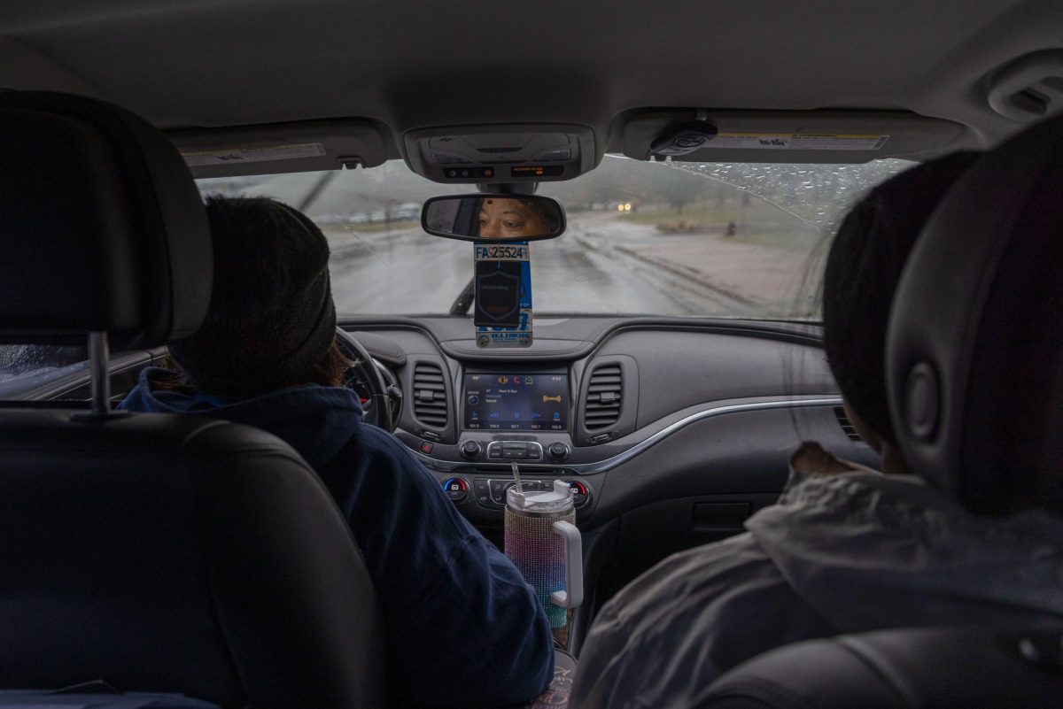 Nancy Maxwell drives Freshman psychology major Ariyonna Jackson and Freshman biological science major Jessica Trujillo to the Carbondale Civic Center for them to same-day register to vote Nov. 5, 2024 at in Carbondale, Illinois.