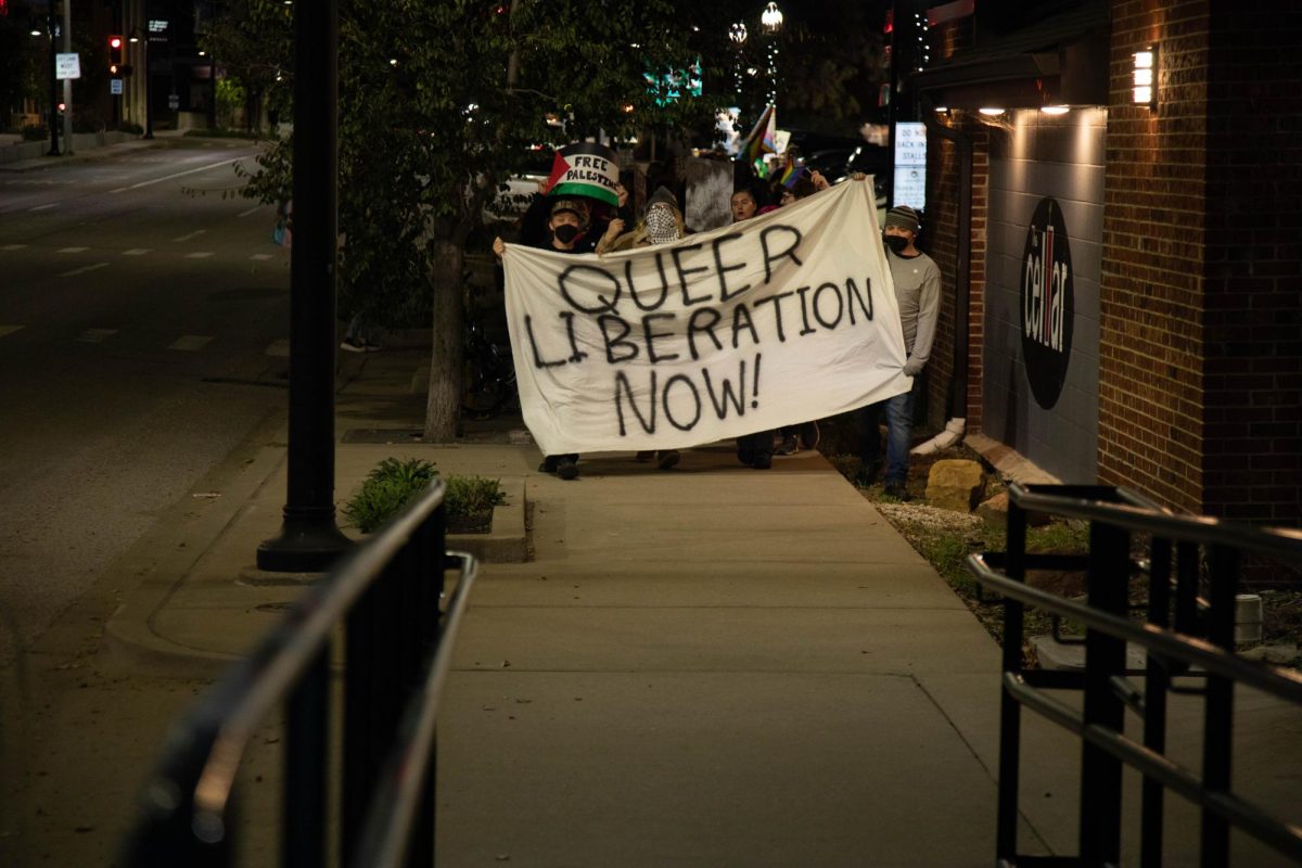 Attendees of the Power in Unity event march from the Carbondale Civic Center down to the Gaia House Interfaith Center Nov. 8, 2024 at the Carbondale Civic Center in Carbondale, Illinois.